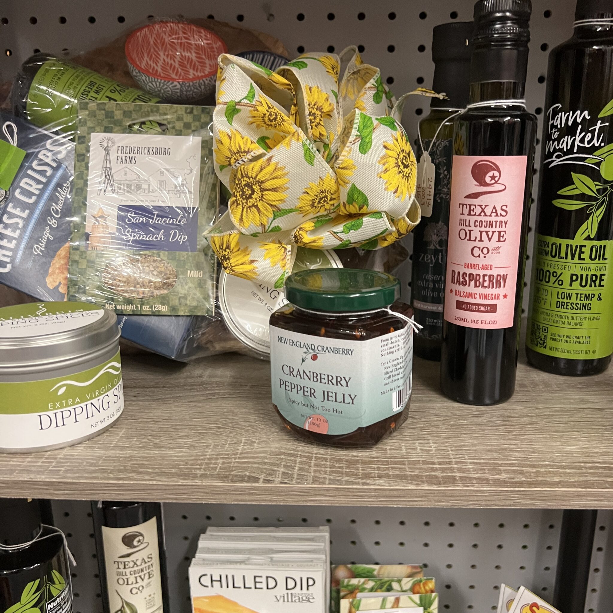 regional olive oils, jellies, dipping sauces, cutting boards, trivets, Texas, mugs, hats